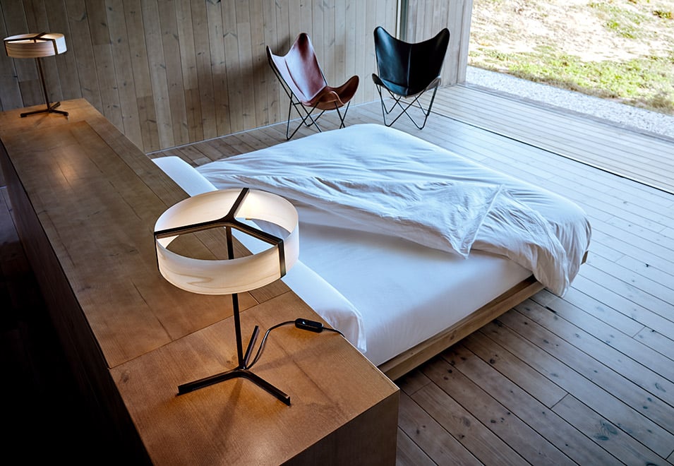 Bedroom of-the-house-of-the-architect-Ramon-Esteve-with-his-metal-and-wood-veneer-table-lamps-designed-for-LZF