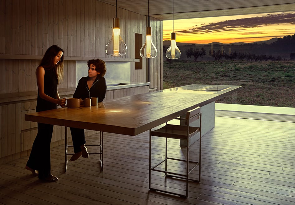 Central table-of-a-kitchen-illuminated-with-LZF-handcrafted-glass-and-wood-lamps