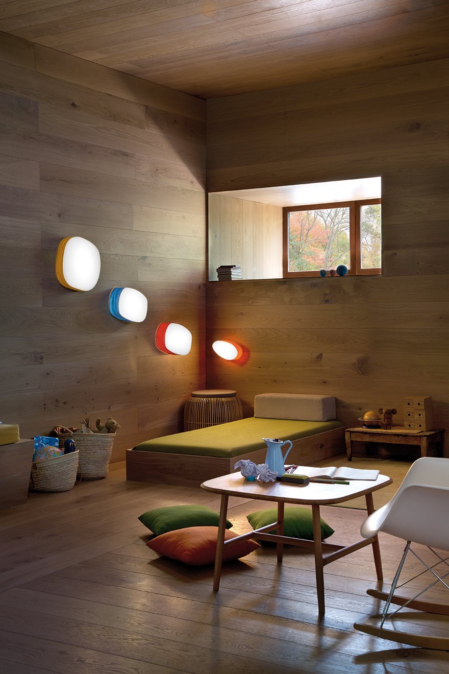 Children's room-illuminated-with-colorful-pebble-shaped-wooden-wall-sconces