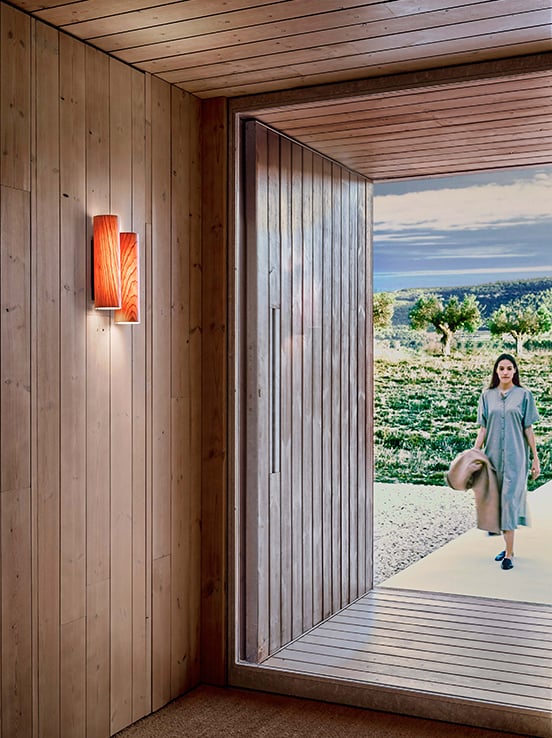 Entrance to-a-house-illuminated-with-a-LZF-wooden-wall-light-cherry