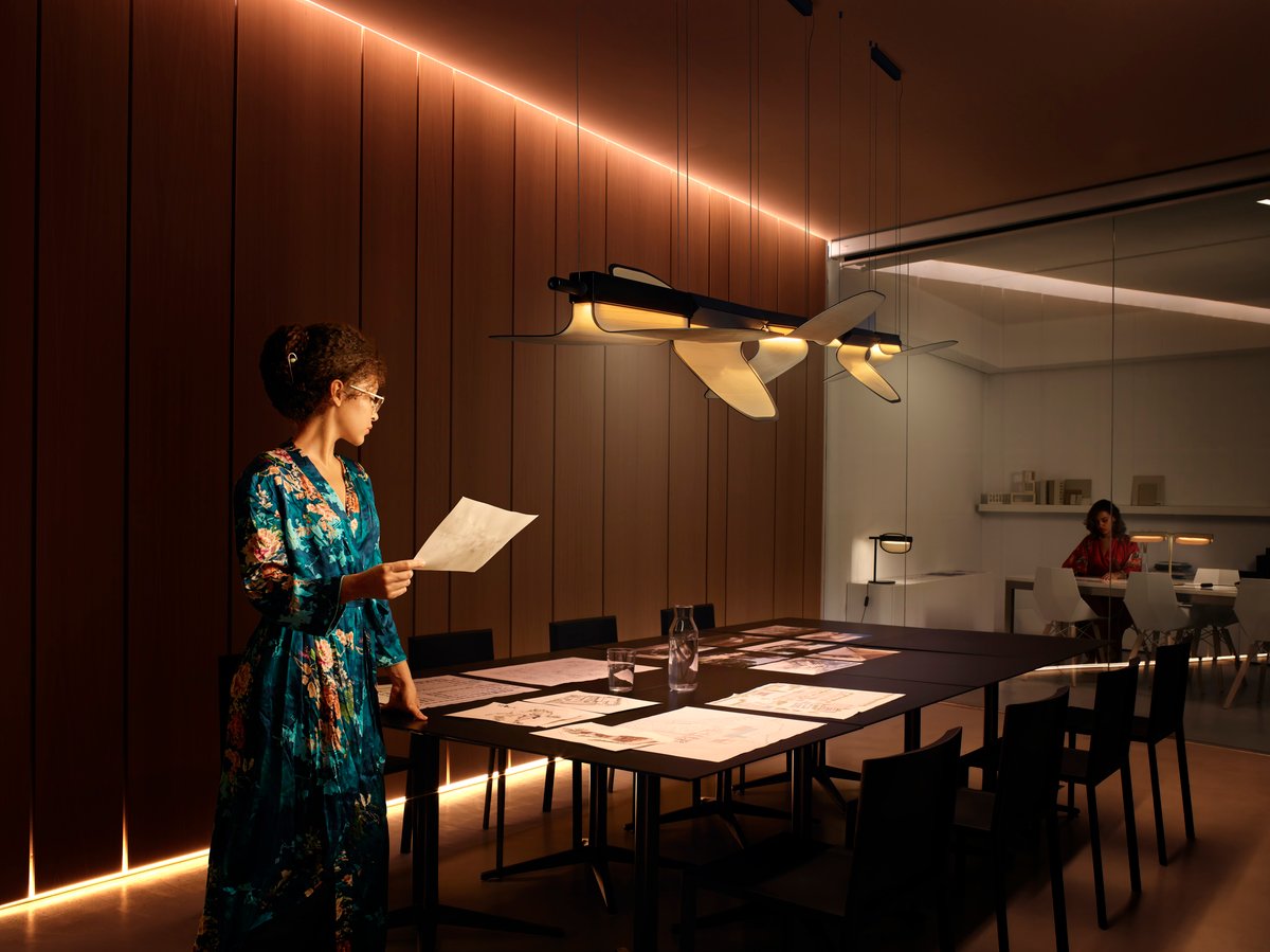 meeting room-illuminated-with-strikingly-designed-lamps-of-wood-leaves-combined-with-metal-that-can-be-rotated-independently