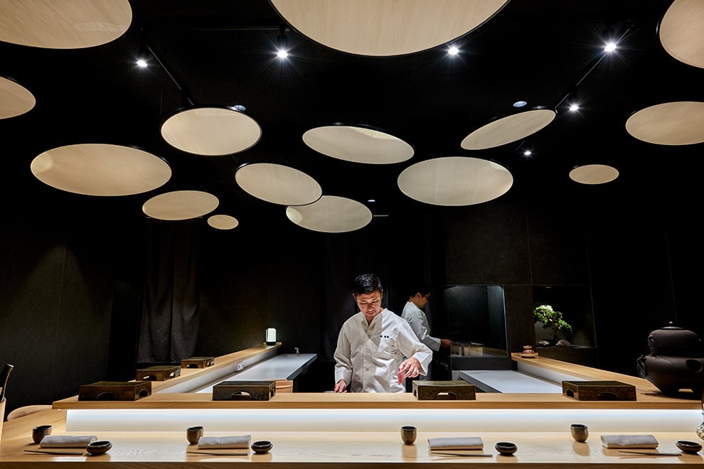 Spectacular Japanese-restaurant-ceiling-decoration-with-natural-wood-circular-panels-hung-at-an-angle